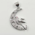Silver crescent moon necklace with a crystal bird pendant and red gem eye accent - Moon Bird Silver Pendant
