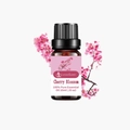 10ml Cherry Blossom essential oil in amber glass bottle with pink floral background - Cherry Blossom (single Ingredient)