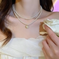Double-layered pearl choker necklace featuring a golden heart pendant for women - 32# Necklace-White
