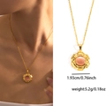 Collier en titane doré avec pendentif engrenage et pierre oeil-de-chat pêche - Pierre d'Œil de Chat Rose