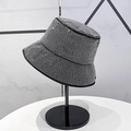 Detailed view of silver rhinestones fully covering a black disco bucket hat - Full Rhinestone Grey Bucket Style