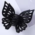 Detail view of large matte black hollow butterfly hair claw clip with 3D wings design - 15CM / Black