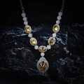Macro view of sterling silver necklace with champagne oval gemstones and micro diamonds - Yellow Zirconia Necklace