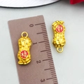Golden peanut-shaped lucky charm pendants with red Fu character and size scale - Fu Character Peanut Style (22807)