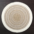 Bohemian round beige jute placemat with white embroidery and fringe on dark wood - 38cm / Fringed Pointed