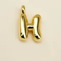 Polished gold initial H alphabet pendant with a glossy metallic mirror finish - Letter H