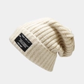 Retro oversized oatmeal knitted beanie with black letter patch and ribbed texture - One Size / Beige