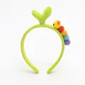 Detail of plush green tulip headband with a colorful caterpillar and soft 3D sprout - Green Sprout