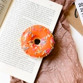 3D orange donut phone socket with colorful sprinkles on minimalist paper background - Donut Holder-Orange