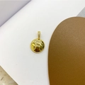 Macro detail of 18K gold plated pendant with micro-paved zircon letter F on round medal - Letter F Pendant + Universal Chain