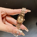 Elegant gold quartz watch for women with oval dial and metal bracelet strap - Rose Gold