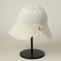 Detail of cream knitted sun hat featuring a soft texture and elegant side bow decoration - M (56-59cm) / White