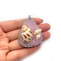 Purple crystal drop pendant with natural shells and white rhinestones on hand - Purple