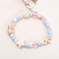 Ethno-Perlenarmband mit hellblauen und rosa Perlen und Seestern-Akzenten - 20 Dopamin Serie E
