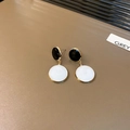 Minimalist black and white enamel geometric drop earrings with gold finish on a tray - Black Geometric