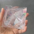 Natural clear white crystal pyramid with inner ice crack texture held in hand - 9.2cm