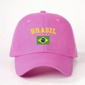 Close-up detail of the yellow Brasil logo and flag embroidery on the pink cotton baseball cap - One Size / Bright Pink