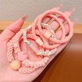 Rosa elastische Haarbänder mit Herz- und Smiley-Anhängern auf der Handfläche - 5er-Pack / Orange