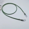 Detail of grass green PU leather strap with white stitching and silver metal lobster clasps - Matcha Green + Silver Hook