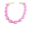 Detailed macro view of pink pig nose link chain with gold lobster clasp and extension - Rose Red