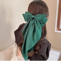 Elegant large green silk ribbon bow hair clip worn on long hair for a stylish look - Dark Green