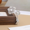 Elegant silver flower brooch with iridescent crystals and pearls in a refined design - AB Rhinestone Flower