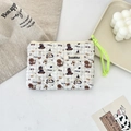 Quilted floral pouch with cartoon dog print and vibrant green zipper pull on a white desk - Skating Dog