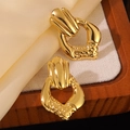 Detail of gold geometric earrings with textured finish on soft silk and wooden tray - Gold Irregular Vintage Geometric Drop Earrings
