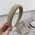 Detailed view of khaki sponge headband featuring premium woven fabric texture and wide design - Khaki