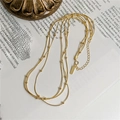Detail der dreilagigen S925 Sterlingsilber Schlangenkette mit goldenem Finish - 925er Silber / Gold