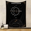 Detail view of black Sagittarius zodiac tapestry with gold print hanging on a wall - Sagittarius