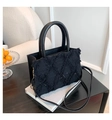 Black leather quilted tote bag with fringe texture and gold metal hardware hooks - Black