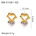 Detail view of gold and silver heart stud earrings with 2.1cm width and 3.2cm height specs - 18K Gold
