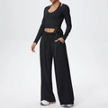 Detail van de zwarte cross-wrap top met lange mouwen en yoga broek met trekkoord - S / Premium Zwart