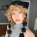 Handmade black crochet beanie with cat ears and star charms shown on a model - Adult 56-59cm / Pure Black