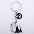 Detail of silver Yorkshire Terrier charm with black and white enamel and paw print tag - Shih Tzu + Paw