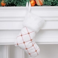 White Christmas stocking with gold sequins and soft faux fur hanging on a white fireplace - Small White