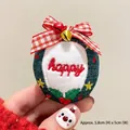 Handmade embroidered Happy Christmas charm with red plaid bow and festive bell detail - Happy Letter Wreath