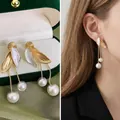 French vintage leaf drop earrings with long pearl tassels and golden accents for women - Golden Leaf Pearl Dangle Clip-on