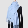 Soft light blue cashmere-feel scarf with elegant fringe detail on mannequin - 200*70cm / Sky Blue