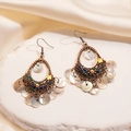 Detail view of ethnic bohemian earrings with colorful beads and white shell pendants - Ear Hook-White
