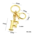 Golden metal letter F keychain with size measurements and lobster clasp detail - Letter F