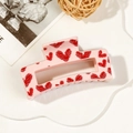 Close-up of a pale pink rectangular hair claw clip with red hand-painted heart patterns - 8.5cm Heart Print - Style A Pink Base