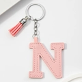 Detailed view of pink PU leather letter N keychain with matching tassel and silver ring - Pink-Letter N