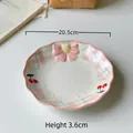 Ceramic salad plate with blue checkered edge, cherry patterns, and pink bow detail - Cherry-8 Inch Round Plate