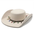 Detail of western fedora hat featuring geometric woven band and colorful bead tassels - Beige