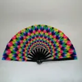 Detail of the vibrant rainbow gradient fabric and black ribs of the handheld folding fan - Colorful Peacock Feather A10