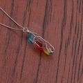 Detail of rainbow resin pillar necklace with intricate silver wire wrapping on wood - A-NSN0235 Platinum Copper Box Chain