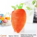 Carrot-shaped plush coin purse in orange with green leaves and a bead chain strap - Carrot