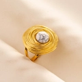Detailed close-up of a vintage bohemian gold ring featuring a white stone inlay - Gold Base-White Pattern Stone